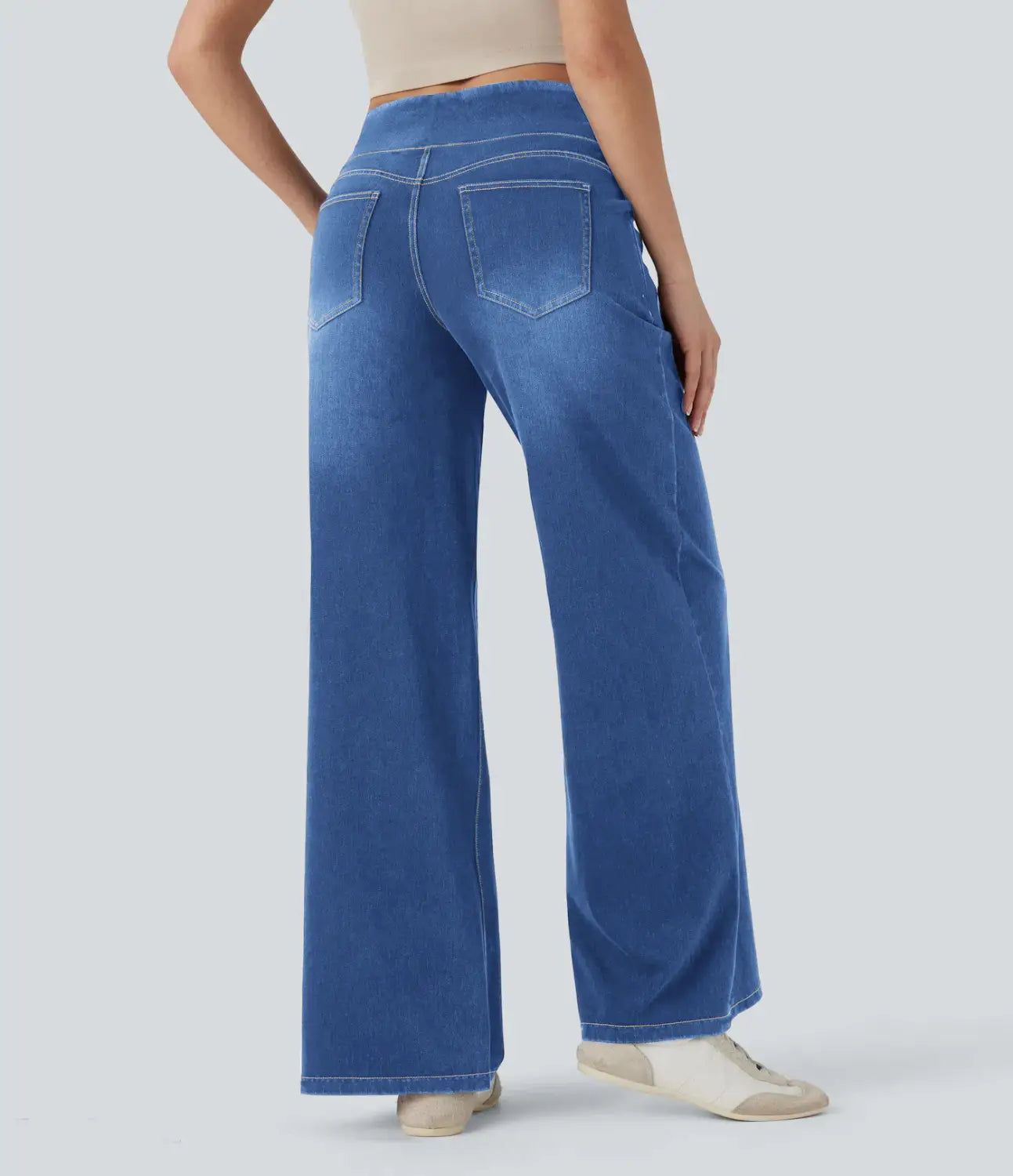 blue wide leg stretchy high waisted denim jeans shown from the back with two pockets and a comfortable fit.