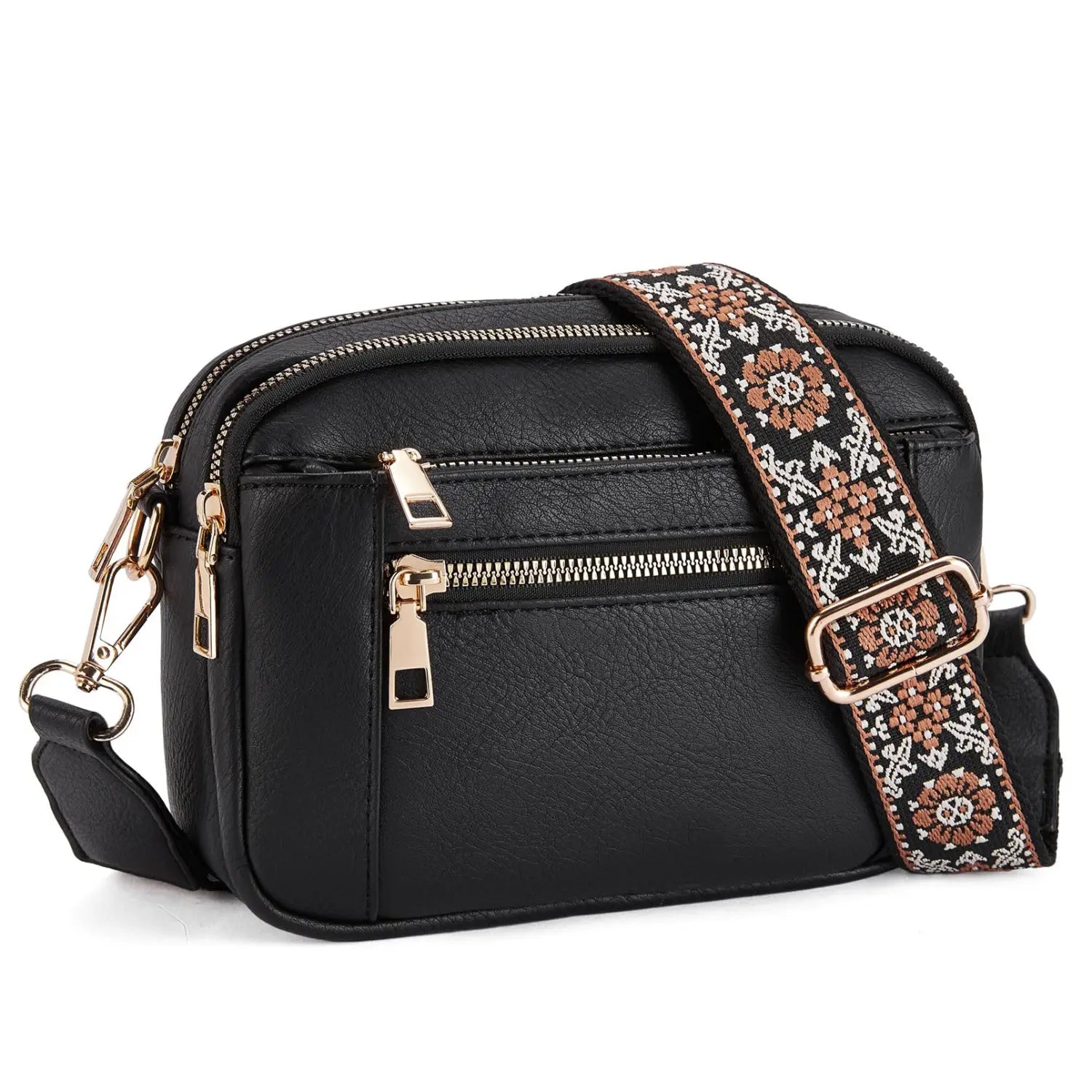Black faux leather crossbody bag with triple gold-tone zippers and a decorative brown beige and white embroidered floral strap.