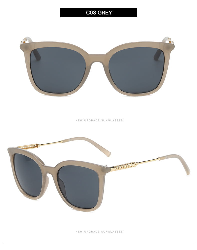 Vintage cat eye sunglasses featuring grey square frames with dark grey lenses and gold-tone temple accents with gold chain detail.
