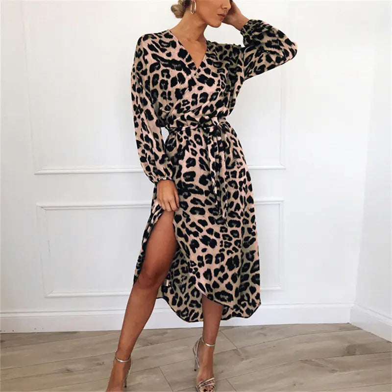 A stylish leopard print v neck long sleeve chiffon wrap dress in soft beige with bold black spots and a high slit.