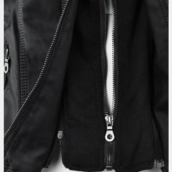 Black faux leather moto jacket with a zipper closure and silver-toned metal zipper pulls featuring a detachable hood.