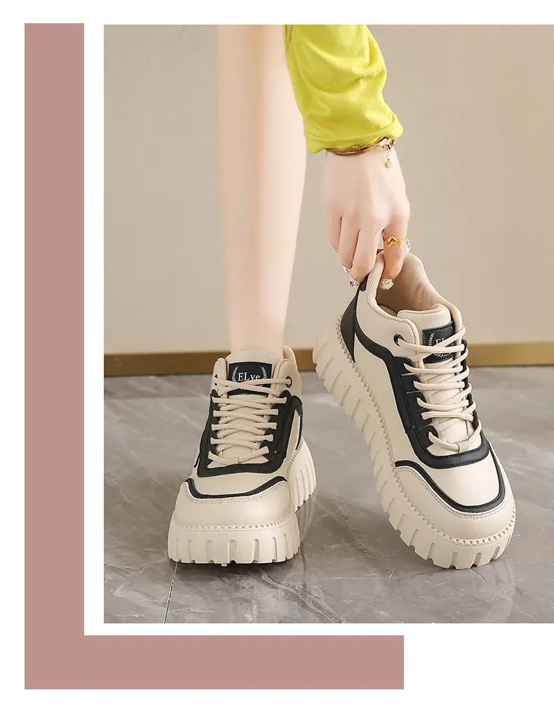 Cream-colored women’s chunky platform breathable high top sneakers with ridged sole and beige suede accents.