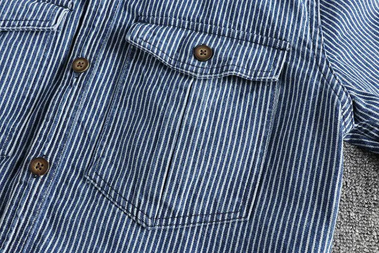 Blue and white vertically striped denim shirt for men with brown wooden buttons.