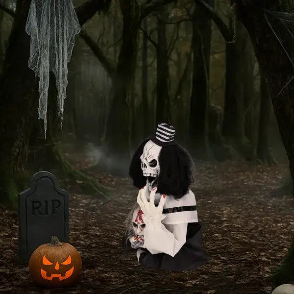 A black and white skeleton figure with long dark hair, wearing a striped hat and holding a smaller skull in its hands, is shown as a scary clown Halloween decoration that is sound activated and 1.8 feet tall.