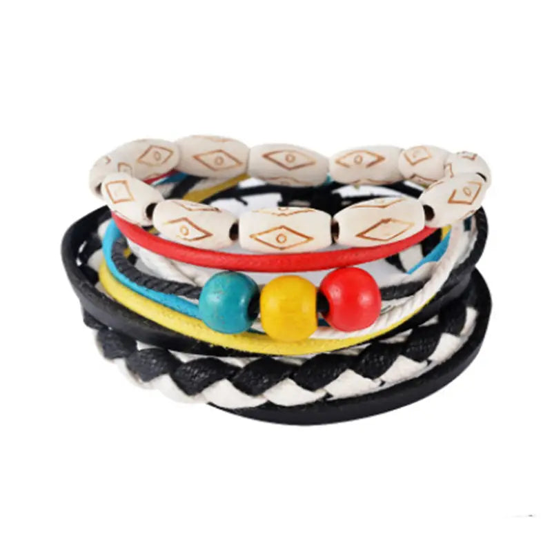 Handmade multilayer braided leather bracelet with colorful leather strands and a white beaded band featuring gold geometric patterns and vibrant teal yellow and red accent beads.