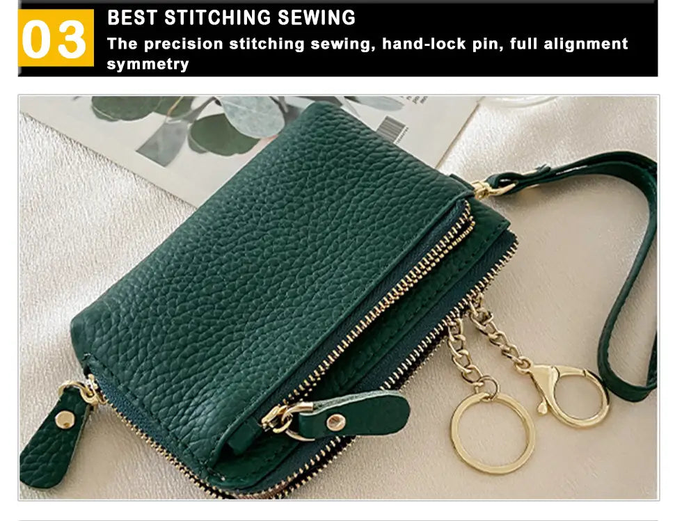Dark green textured leather wristlet wallet with gold hardware featuring gold-toned zippers and a matching wrist strap.