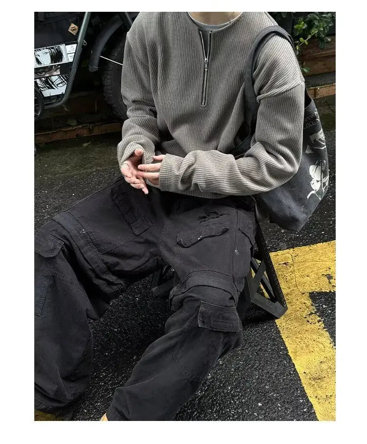 Sudadera tipo jersey acanalada gris de media cremallera para hombre, con mangas largas, confeccionada en tejido de punto para uso casual y formal.