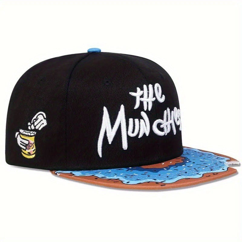 black flat brim snapback cap titled the munchies featuring white embroidered text with a cartoon hand holding a beer can on the side and a blue liquid splatter design on the brown brim