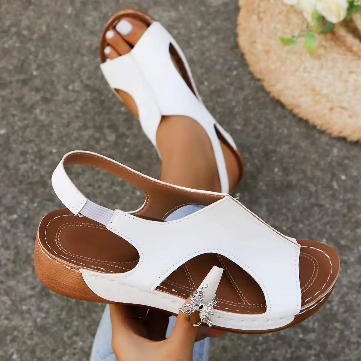 Tan recycled leather wedge sandals for women with elastic straps cutout details and white stitching for summer wear