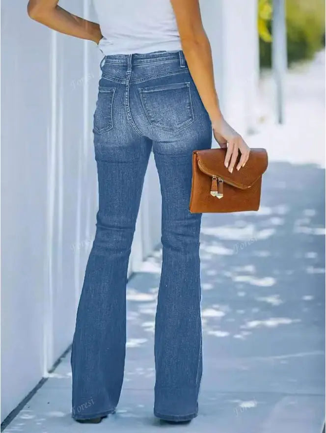 brown leather clutch with gold tone hardware paired with light wash flare jeans for women featuring button slim denim design.