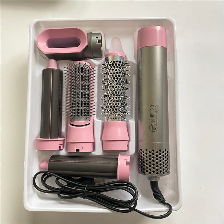 pink and silver 5-in-1 hot air comb hair dryer and styler set with multiple styling attachments for versatile hair drying and styling