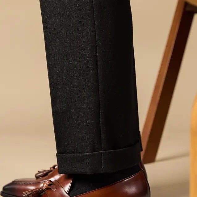 polished genuine leather tassel loafers in black patent leather with a glossy finish and classic design