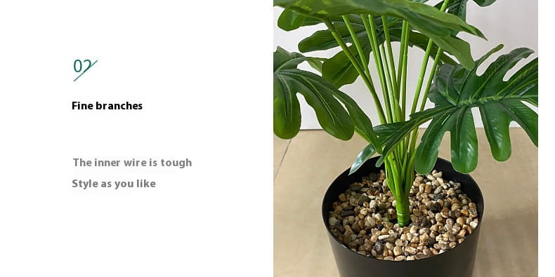 Artificial monstera turtle leaf potted plant featuring green glossy leaves in a black pot filled with decorative pebbles for garden decor.