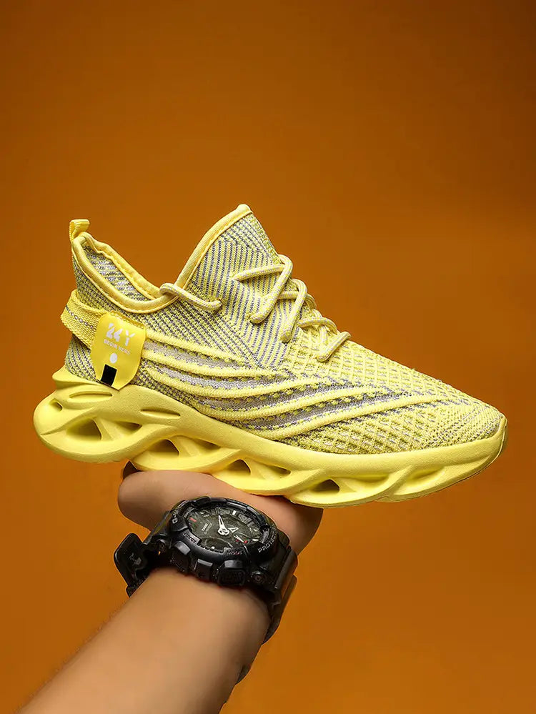 Bright yellow flyknit mesh platform running shoe for men with a textured breathable upper and bold sculpted midsole.