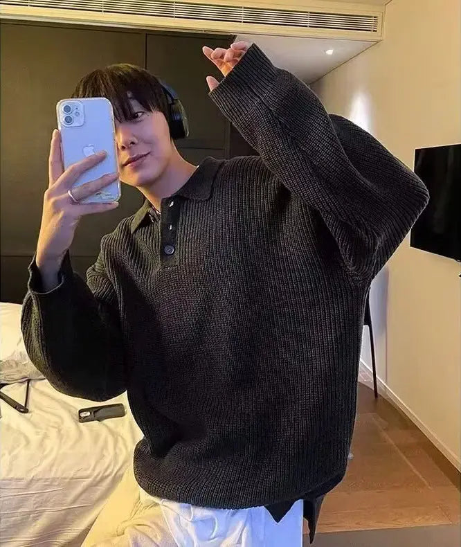 men long sleeve knit polo sweater in black ribbed knit fabric featuring a buttoned collar and long sleeves for a stylish and comfortable look.