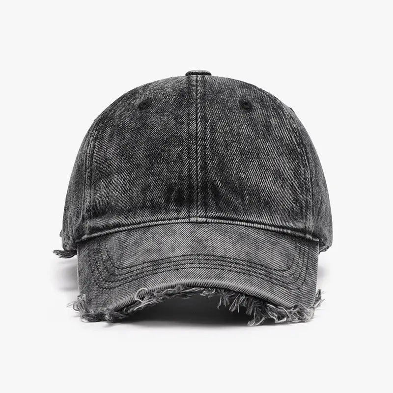 A distressed denim baseball cap in black with frayed edges and a faded, worn texture.