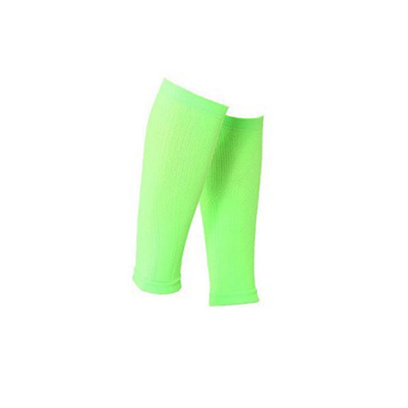 Bright neon green compression calf sleeves with ribbed texture designed for athletic sports support.