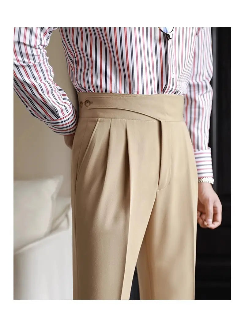 Beige pleated wool tailored trousers for men with a high waist and button closure in a straight leg design.