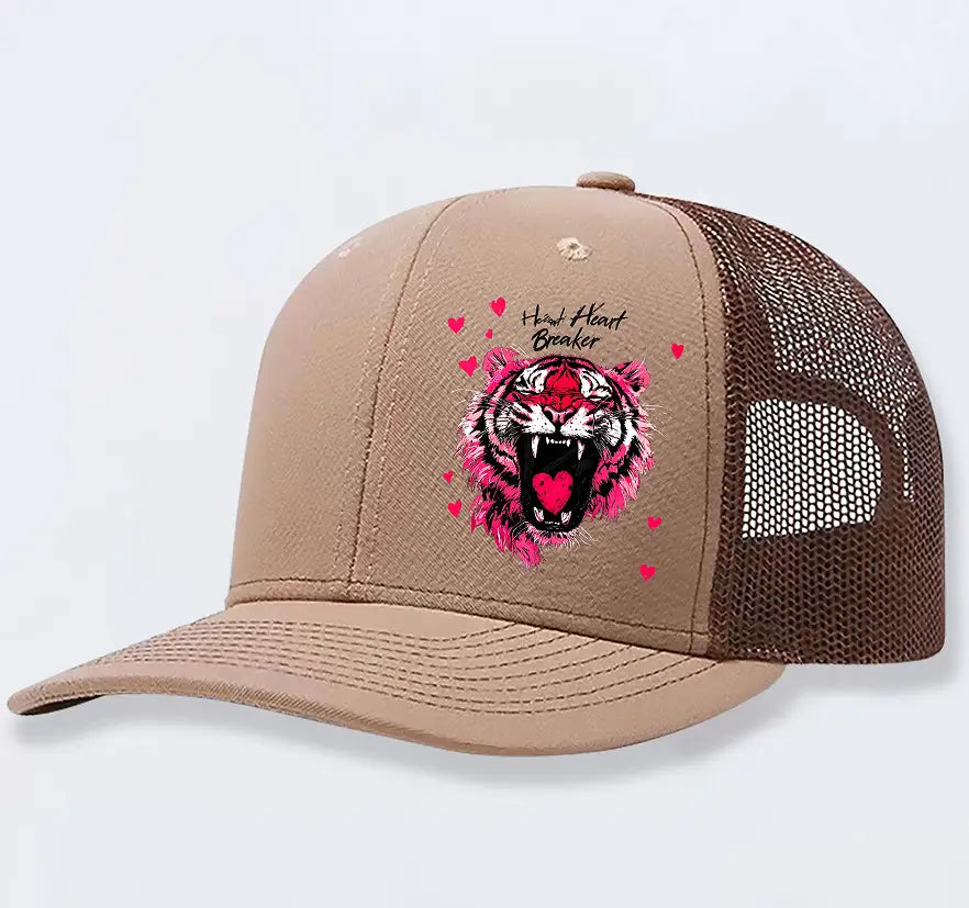 Tan trucker hat featuring a pink and white tiger graphic with heart breaker text and red hearts designed for men.