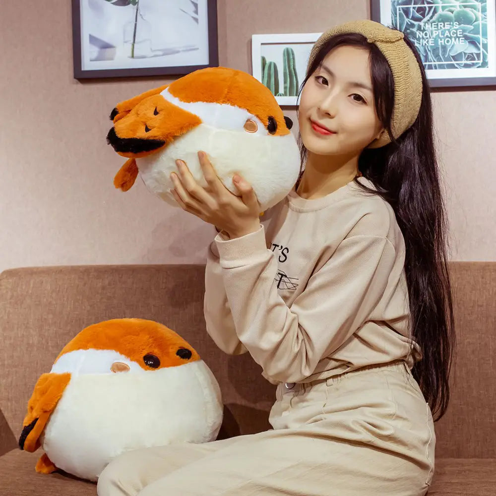 Orange and white plush sparrow bird toy with black eyes and beak soft animal doll for children and collectors.