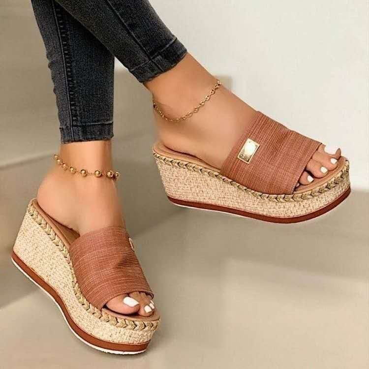 Tan woven platform wedge espadrille sandals with braided rope detail and a small gold-tone rectangular buckle.