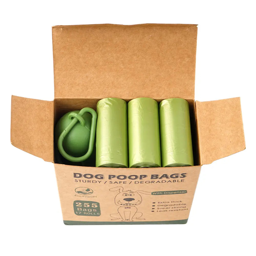 Green thickened biodegradable dog waste bags in a cardboard box with an attached green dispenser for convenient pet poop disposal.