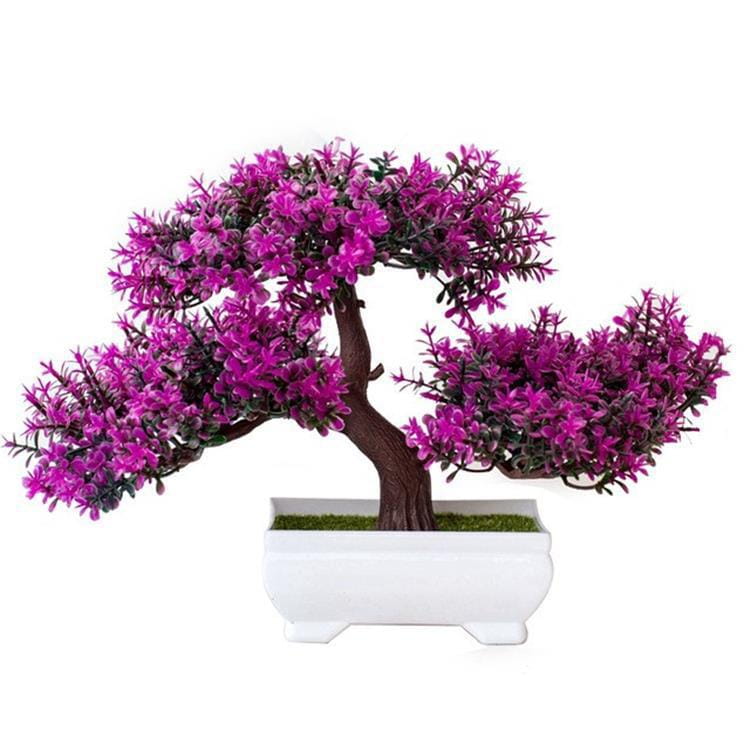 Ein lebhaftes künstliches Bonsai-Bäumchen in Violett mit detaillierten Ästen und Blüten, präsentiert in einem eleganten weißen Keramiktopf.