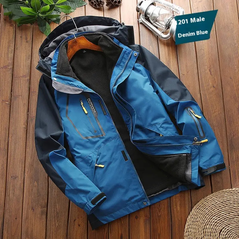Denim blue and black men three-in-one waterproof winter sportswear jacket with yellow zipper pulls designed for outdoor use.
