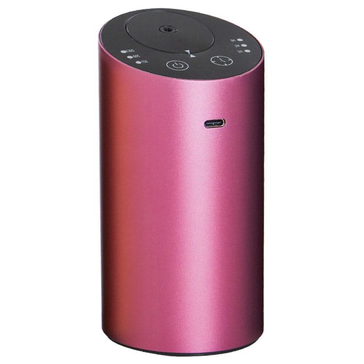 Diffuseur d’arômes portable cylindrique métallique rose, humidificateur de voiture sans fil USB, avec un panneau supérieur noir comportant des boutons de commande et un port USB-C.