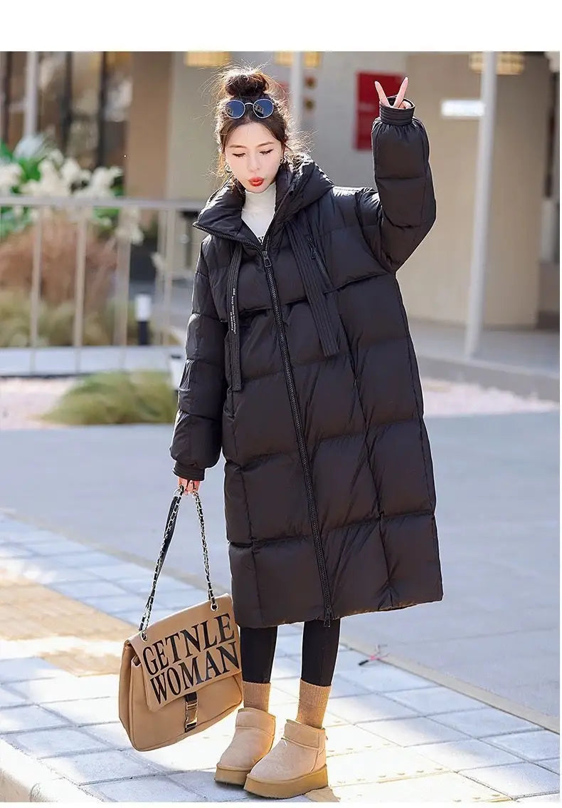 black quilted women long hooded puffer coat with front zipper designed for warmth and style in cold weather