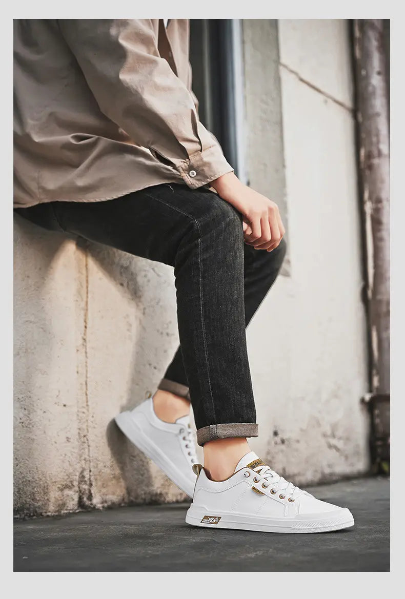 Men’s white minimalist leather casual sneakers with low-top canvas design gold-tone laces and subtle side logo.