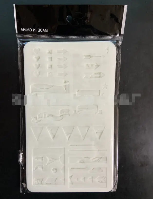 white silicone mold with embossed geometric and symbol designs packaged in clear plastic for the Sank Magic Practice Copybook Set for kids preschoolers