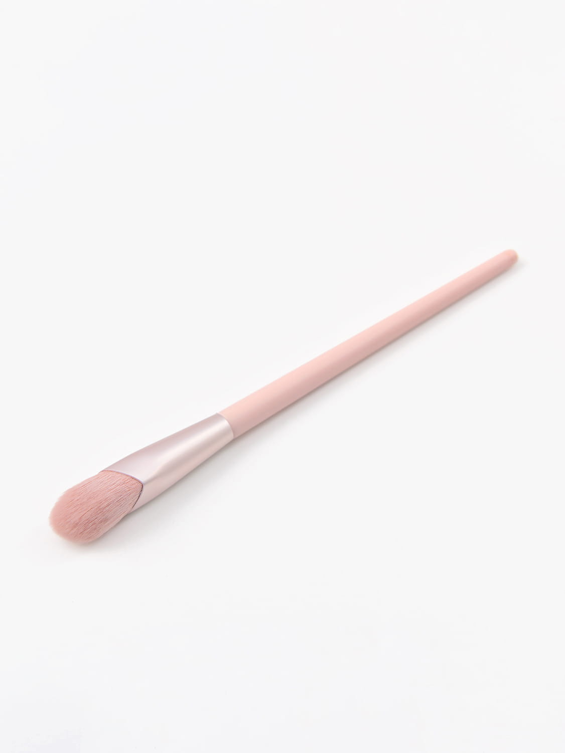 A soft pink finger belly makeup brush professional contour tool with a sleek matte-finished handle and matching blush-rose bristle head.