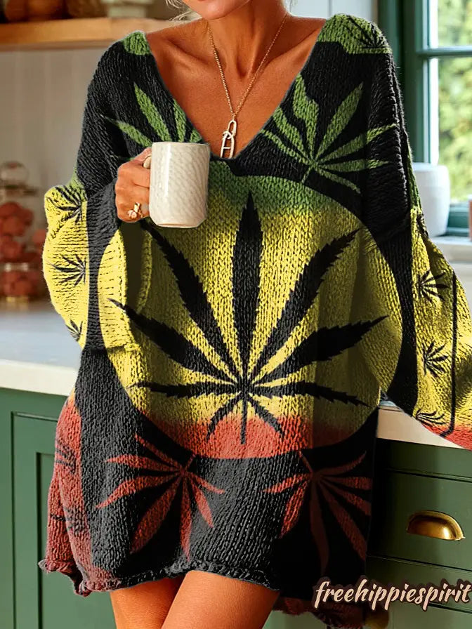Suéter de punto con cuello en V que presenta un llamativo patrón de hoja de cannabis negro, amarillo y rojo, en un diseño inspirado en el suéter esponjoso de gato navideño bordado.
