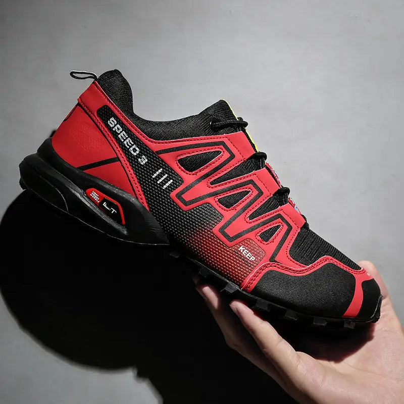 Men’s trail running shoes in red and black keen speed 5 design with breathable mesh upper and rugged outsole for enhanced traction.