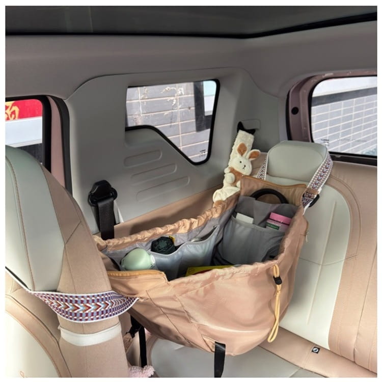 Beige and gray multifunctional waterproof nylon car seat organizer with patterned straps shown from the back side designed for use as a fashion tote and backpack.