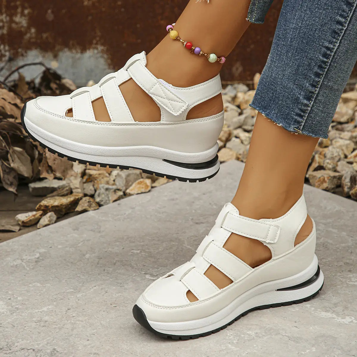 Breathable hollow white wedge platform sandals featuring multiple velcro strap closures and a chunky sole for comfortable wear.