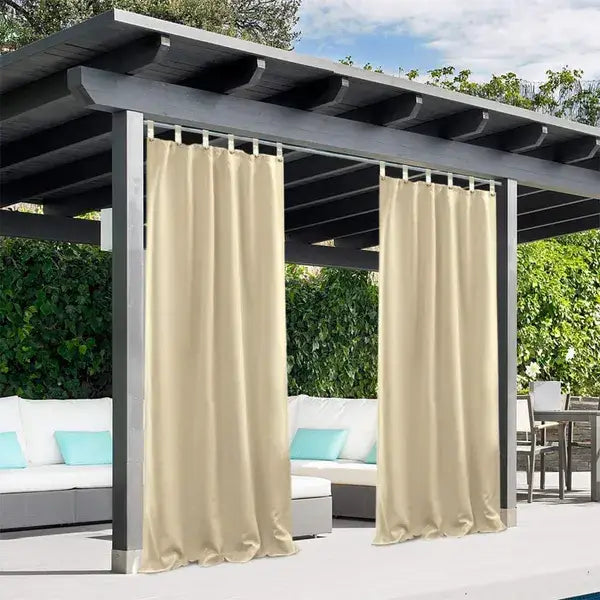 Beige outdoor curtains made of luxurious woolen fabric with a simple elegant design hanging from a dark gray pergola.