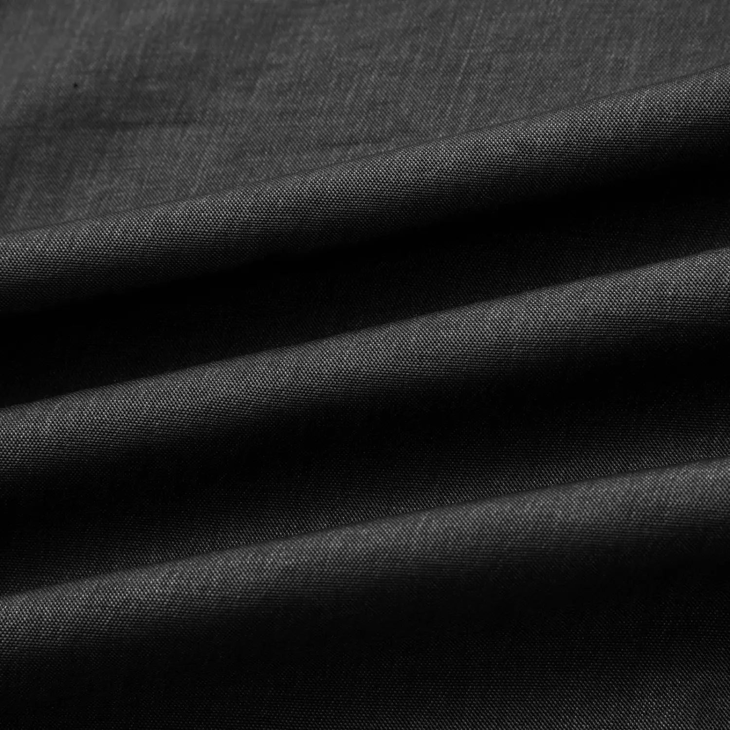 black textured fabric with a subtle woven pattern on a men’s slim fit sleeveless denim henley shirt.