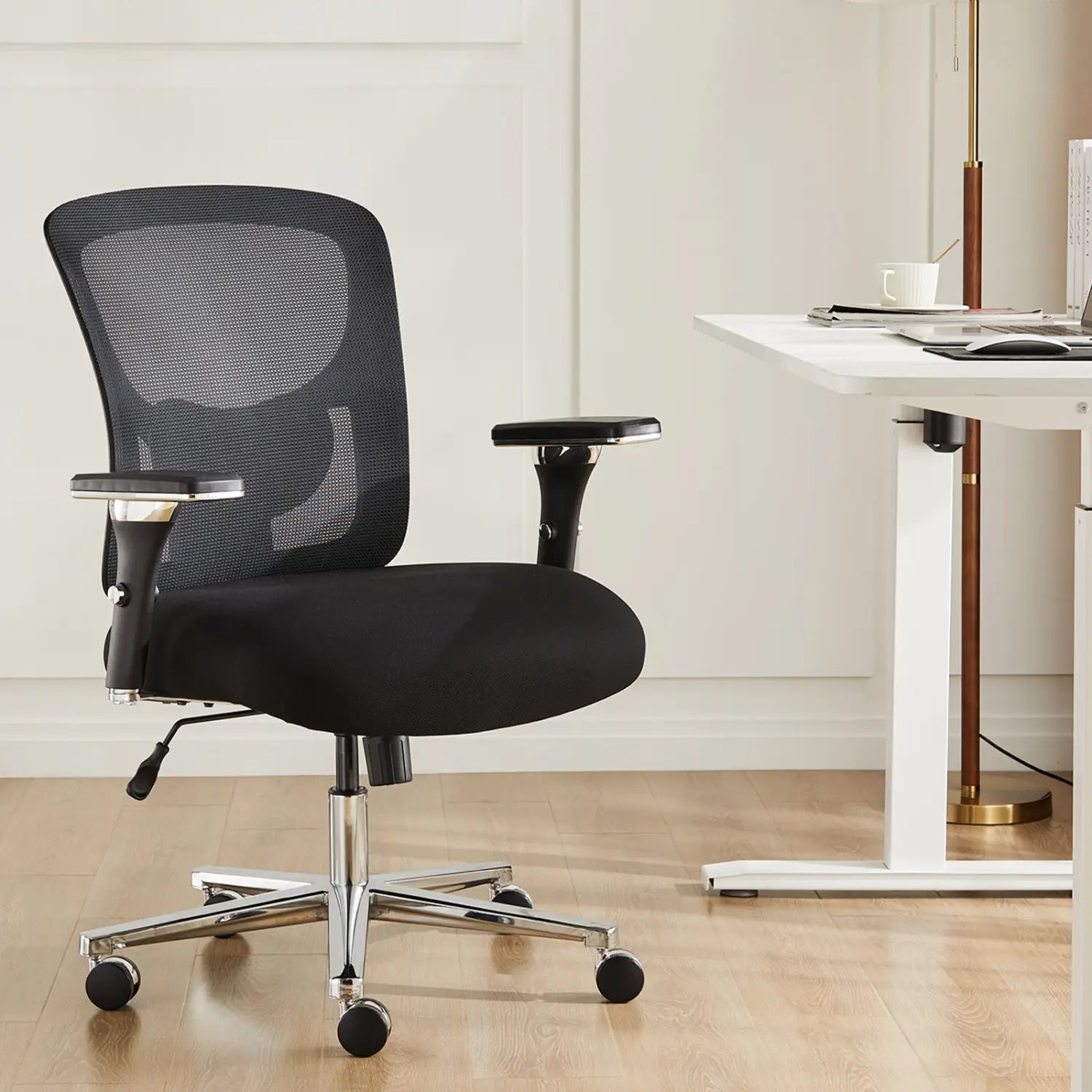 Black mesh big and tall office chair with ergonomic seat, chrome base, and casters designed for 500lb capacity.