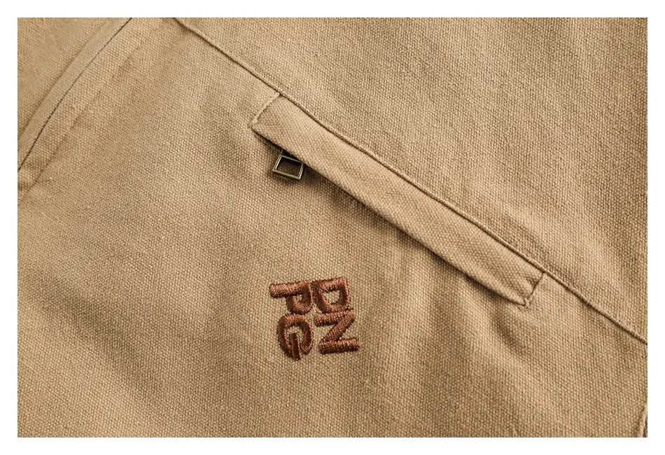 Beige cotton retro washed Detroit jacket for men with a brown embroidered logo on the chest.