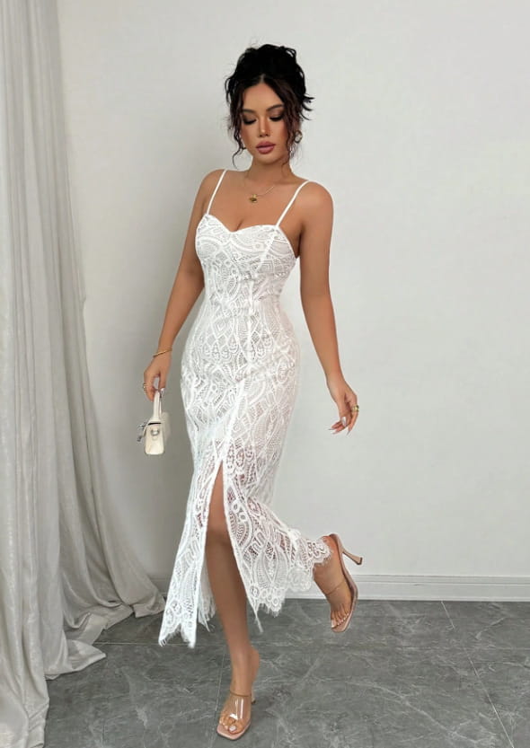 White lace midi dress with thin spaghetti straps and a high slit featuring floral lace v neck design and side slit.