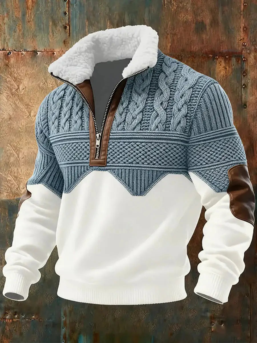Men’s blue and white cable knit half zip sweater with faux fur collar and brown leather accents.