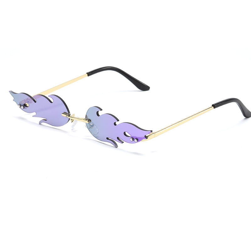 Metallic flame gemstone sunglasses with purple flame-shaped gradient lenses and gold-toned metal frames with black temple tips.