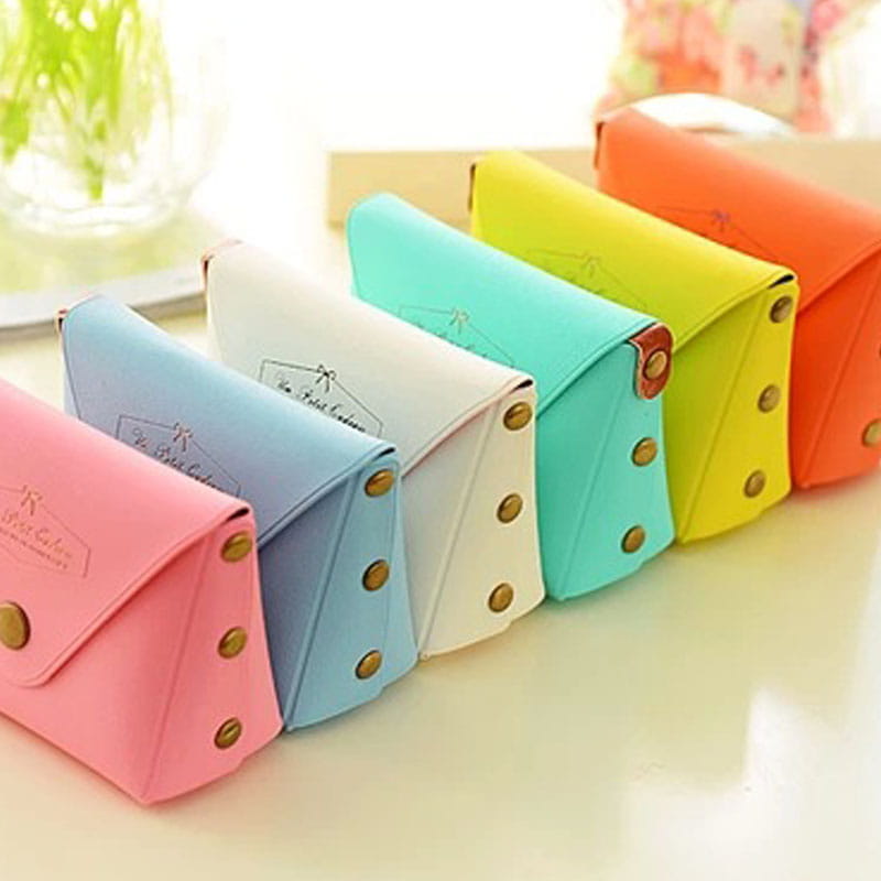 macaron pastel leather and pvc coin purse set featuring pastel-colored compact wallet-style pouches with gold-tone button closures and subtle embossed branding