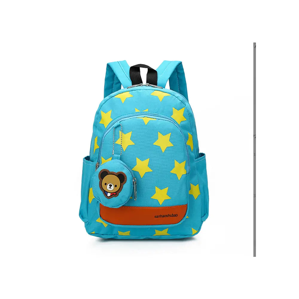 Star print soccer backpack in bright blue with a yellow star pattern and a cute brown bear face charm on the front pocket.