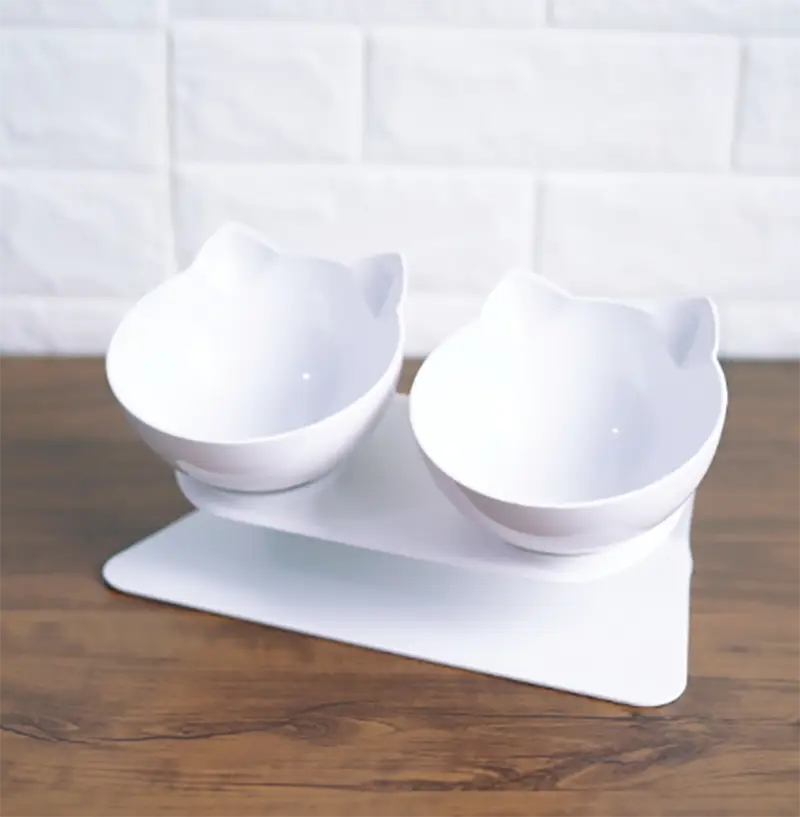 white cat-shaped orthopedic pet food bowls with ear details mounted on a matching white stand designed for slanted neck protection