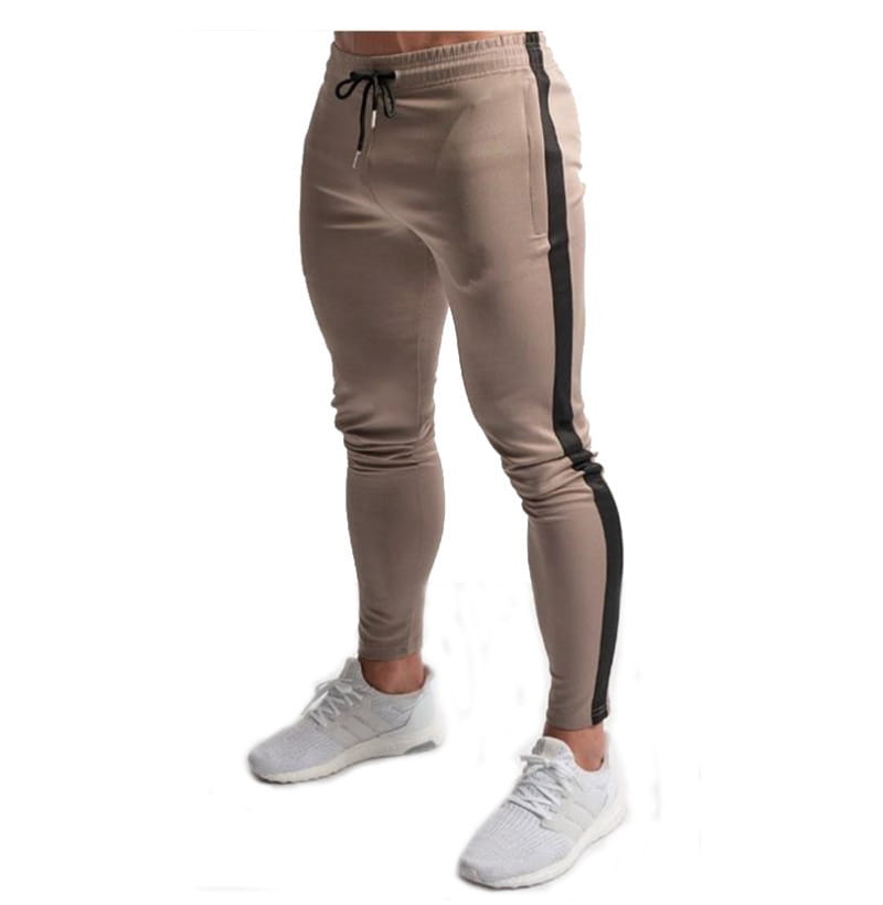 Men slim fit athletic joggers in beige cotton with a black side stripe and drawstring waistband for sports and casual wear.