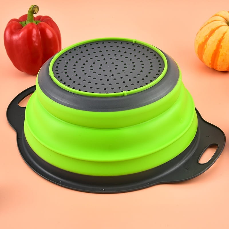 Bright green and black collapsible silicone colander with a perforated top from the collapsible silicone colander set drain basket.