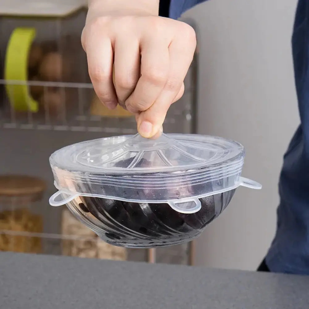 Clear silicone stretch lid with flexible elastic bands and ridged center in 6-pack reusable food storage set